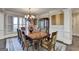 Spacious dining room with a large table and decorative furnishings at 10125 Brixton Pl, Suwanee, GA 30024