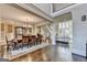 Formal dining room with hardwood floors and a large window at 10125 Brixton Pl, Suwanee, GA 30024