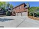 Beautiful brick home featuring a three-car garage at 10125 Brixton Pl, Suwanee, GA 30024