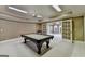 Game room with pool table and neutral walls at 10125 Brixton Pl, Suwanee, GA 30024
