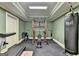 A home gym with weights and exercise equipment at 10125 Brixton Pl, Suwanee, GA 30024