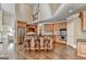 Spacious kitchen features an island with bar seating, stainless steel appliances, and hardwood flooring at 10125 Brixton Pl, Suwanee, GA 30024