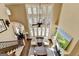 Bright living room with fireplace, built-ins and large windows at 10125 Brixton Pl, Suwanee, GA 30024