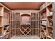 Home wine cellar, with extensive custom racking for wine storage at 10125 Brixton Pl, Suwanee, GA 30024