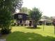 A sprawling backyard with mature trees and ample space for outdoor activities at 4213 Janice Drive, Atlanta, GA 30337