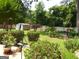 Well-maintained backyard with lush landscaping, a storage shed, and a privacy fence perfect for outdoor enjoyment at 4213 Janice Drive, Atlanta, GA 30337