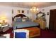 Spacious main bedroom features a chandelier and plenty of natural light at 4213 Janice Drive, Atlanta, GA 30337