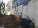 Rear exterior view with functional units, set against the home's white brick and garden at 4213 Janice Drive, Atlanta, GA 30337