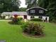 Lush front yard with meticulously maintained landscaping adds to the curb appeal at 4213 Janice Drive, Atlanta, GA 30337