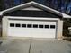 Garage door with multiple glass window panes at 4213 Janice Drive, Atlanta, GA 30337