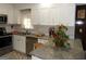 Well-appointed kitchen featuring white cabinets, granite countertops, and updated stainless steel appliances at 4213 Janice Drive, Atlanta, GA 30337