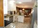 Spacious kitchen with stainless steel appliances, granite countertops, and a view of the dining area at 4213 Janice Drive, Atlanta, GA 30337