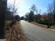 Neighborhood street view near the property, showcasing mature trees and a peaceful setting at 4213 Janice Drive, Atlanta, GA 30337