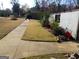 Landscape view showcasing a well-manicured lawn and stepping stone path, adding to the property's charm at 4213 Janice Drive, Atlanta, GA 30337