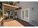 Inviting back deck with a wood pergola, French doors, and ample space for outdoor seating at 419 Tea Rose N Ln, Stockbridge, GA 30281
