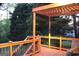 Relax on this wooden deck with a pergola and decorative railings, perfect for outdoor entertaining at 419 Tea Rose N Ln, Stockbridge, GA 30281