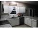 Well-lit kitchen with granite countertops, white cabinets, and stainless steel appliances at 419 Tea Rose N Ln, Stockbridge, GA 30281
