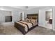 Well-lit main bedroom offering a king-sized bed with decorative pillows and an ensuite bathroom at 419 Tea Rose N Ln, Stockbridge, GA 30281