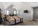 Spacious main bedroom featuring vaulted ceilings, a sitting area, and a king-sized bed with decorative pillows at 419 Tea Rose N Ln, Stockbridge, GA 30281