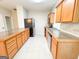 Well-lit kitchen featuring a stainless steel refrigerator and wooden cabinets at 33 Corinth Rd, Cartersville, GA 30121