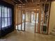 Unfinished basement with exposed studs, a window and concrete flooring at 6281 Vinings Vintage Dr, Mableton, GA 30126