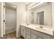 Bathroom with double sink vanity, a large mirror, and a combination shower and tub at 6281 Vinings Vintage Dr, Mableton, GA 30126