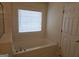 Bathroom featuring a large soaking tub and a window at 6281 Vinings Vintage Dr, Mableton, GA 30126