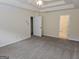 Spacious carpeted bedroom with neutral tones and multiple doors at 6281 Vinings Vintage Dr, Mableton, GA 30126