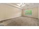 Primary bedroom features beige carpet, a ceiling fan and natural light at 6281 Vinings Vintage Dr, Mableton, GA 30126
