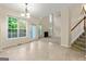 Sunny breakfast nook with tile floors, multiple windows, and access to the living room at 6281 Vinings Vintage Dr, Mableton, GA 30126