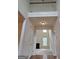 Bright foyer with hardwood floors, high ceilings, and a view into the living room at 6281 Vinings Vintage Dr, Mableton, GA 30126