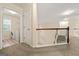 A second-floor hallway offers a glimpse of the laundry room and staircase at 6281 Vinings Vintage Dr, Mableton, GA 30126