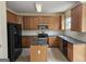 Kitchen features wood cabinets, stainless steel appliances, kitchen island, and tile backsplash at 6281 Vinings Vintage Dr, Mableton, GA 30126