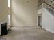 Spacious living room with a fireplace and ceiling fan, adjacent to the staircase at 6281 Vinings Vintage Dr, Mableton, GA 30126