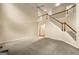 Bright and airy living room featuring a staircase, high ceilings, and a ceiling fan at 6281 Vinings Vintage Dr, Mableton, GA 30126