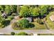 Beautiful aerial view of a charming home surrounded by lush trees and a well-manicured lawn in a peaceful neighborhood at 310 Hamdon Kells, Peachtree City, GA 30269