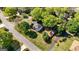 Birds eye view of a beautiful home surrounded by lush greenery, showcasing its well-maintained yard and inviting exterior at 310 Hamdon Kells, Peachtree City, GA 30269