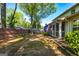 Backyard featuring a screened porch and mature trees at 310 Hamdon Kells, Peachtree City, GA 30269