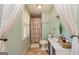 Cozy bathroom with a window, shower, and toilet at 310 Hamdon Kells, Peachtree City, GA 30269