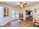 Bonus room with a ceiling fan, double doors, and a view into the dining area at 310 Hamdon Kells, Peachtree City, GA 30269