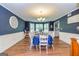 Spacious dining room with large windows, hardwood floors, and ample seating for Gathering meals at 310 Hamdon Kells, Peachtree City, GA 30269