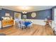 Elegant dining room with wainscoting, hardwood floors, and stylish furnishings for formal gatherings at 310 Hamdon Kells, Peachtree City, GA 30269
