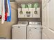 Clean and organized laundry room with washer, dryer, and plenty of storage at 310 Hamdon Kells, Peachtree City, GA 30269