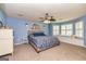 Spacious primary bedroom with a plush bed and lots of natural light at 310 Hamdon Kells, Peachtree City, GA 30269