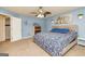 Blue walled primary bedroom featuring a king bed and adjacent closet at 310 Hamdon Kells, Peachtree City, GA 30269