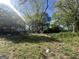 Lush backyard featuring mature trees, greenery, and ample space for outdoor activities and relaxation at 4582 Hendrix Dr, Forest Park, GA 30297