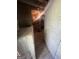 A portion of a basement showcasing foundational components, including a wooden beam, and cement support structures at 4582 Hendrix Dr, Forest Park, GA 30297