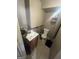 A small bathroom with a toilet and sink at 4582 Hendrix Dr, Forest Park, GA 30297