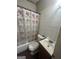 Modest bathroom featuring a tub with shower, toilet, and vanity at 4582 Hendrix Dr, Forest Park, GA 30297