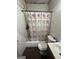 Modest bathroom featuring a tub with shower, toilet, and vanity at 4582 Hendrix Dr, Forest Park, GA 30297
